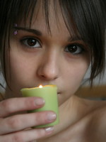 ariel rebel plays with candles