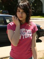 cute teen model poses in street