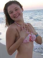 amazing teen christine young flashing her tits on the beach
