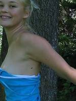 pretty blonde teen girl christine young posing in a park